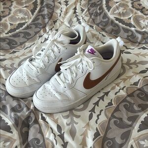 Nike White Low-Top Sneakers with Brown Swoosh